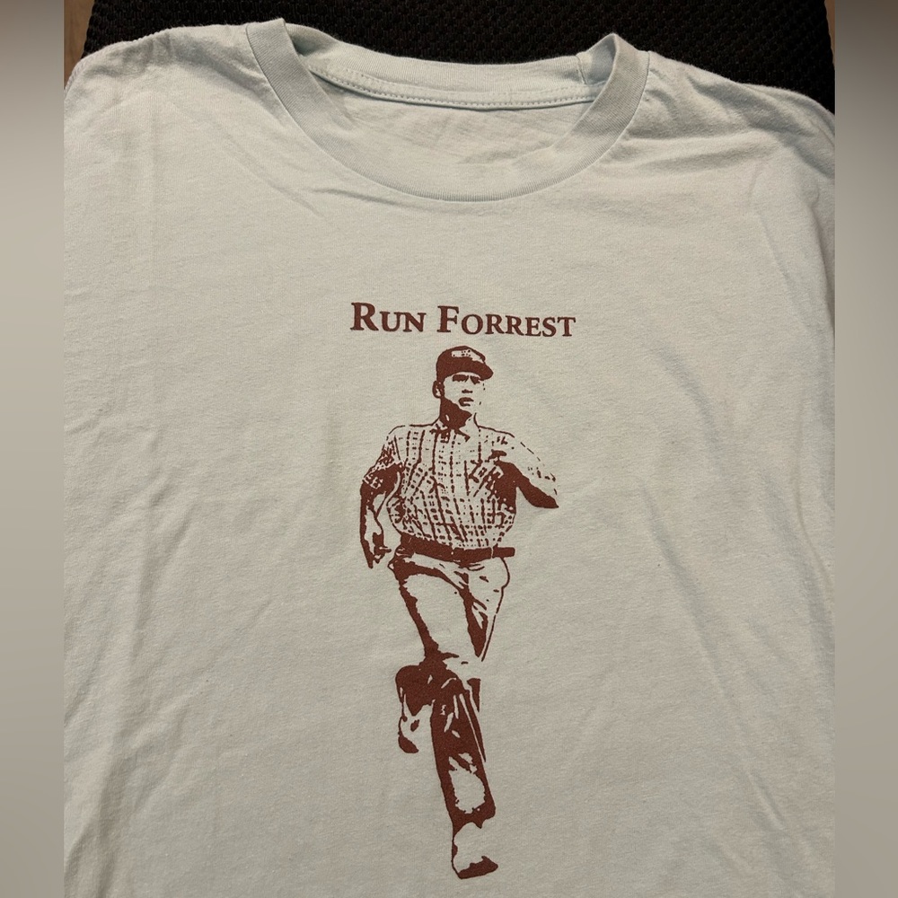 Run Forrest t-shirt; pale blue with brown; no tag but like Men’s Medium.